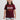 Young girl wearing maroon t-shirt with puff print "Gracie Barra Brazilian Jiu-Jitsu" logo, smiling against a white background.